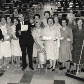 Tom Reynolds with the staff at Crimdon Pavillion, we had some great dances in there, we used to get 650 to 700 in the hall from the factories, Dewhurst was one-off the best as my mate and I were invited up to the factory to get measured for a couple of new shirts every year. Murton Colliery Mechanics, used to arrive in 7or 8 Double Deckers, we had workmen's clubs from Stockton and Middlesbrough, they used to bring all the children and have a party in the Dene, some of the parents went back with the children but quite a few stayed the night for a dance, Happy Days. 
Caption from Bob Williams