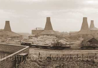 John Candlish opened his bottleworks in 1853 and absorbed the nearby Fenwick's Bottleworks in 1856. When he died in 1874 his factory consisted of seven bottlehouses. In this photograph the seventh ( close to Gallery Row at right ) has not yet been builtPhotograph 1870.Prior to these bottleworks there was a small glassworks in the yard of The Canterbury in North Railway St