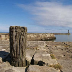 View across the dock to the lighthouse in 2007.
Photograph by Brian Slee.