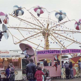 The Hoppings, Newcastle's annual fair on the Town Moor.
Europe′s largest travelling Fun Fair  held during Race Week in June every Year.
The history of The Hoppings goes back to the early 1700s when horse racing took place on the moor but as the word Hoppen is Anglo Saxon for fair it's origins may be very early indeed.
Photograph 1978