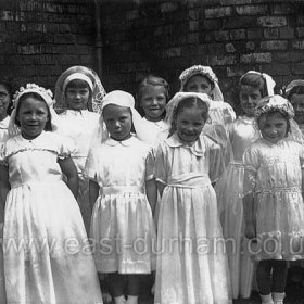 St Mary Magdalen's, Vane Terracece 1951. Girls in their Holy Communion dresses.
L to R; ?, Curran, Mary Hall, ?, ?, Mary Olley, ?, Joan Olley, ?, ?, ?, Ann Baxter