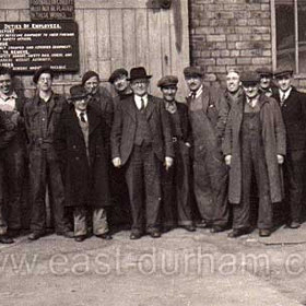Outside the joiners shop of JL Thompson's Shipyard around 1945 / 48.    
From the left Morris Eastern,  Alf Redford ,  Ray Hunter, Geordie Fenwick (SHIP FOREMAN) , not known,  Billy Boyd,  Ernie Riddle, (HEAD FOREMAN),  Jimmy Wake,  Alf Marlborough,  Billy Elliot,  Jack Chapman,  Marvo (nick name),  Geordie Duggan , not known.    
J L Thompson was the biggest yard on the wear and built the biggest ships. If you stood on Wearmouth Bridge and looked east down the river it was on the left.
Photograph and caption from Alf Redford