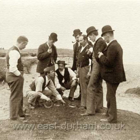 Playing quoits on the beach at Deneholme c1900