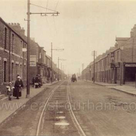 Four Lane Ends, Hetton in the 1920s. This seems to show the Easington to Wardley road (later A182), looking north-westward in the direction of Hetton from the bottom of Pemberton's Bank, a fearsome hill which remained cobbled until at least the 1960s.  The tram track laid into the road led from Easington Lane clock and War Memorial to Sunderland via (I think) Philadelpha and Herrington Burn.  The business premises on the right was a hairdresser's in the 1960s.
Caption by Sheldon Clark